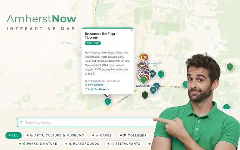 A graphic showing someone pointing at the interactive things to do map of the Amherst area.